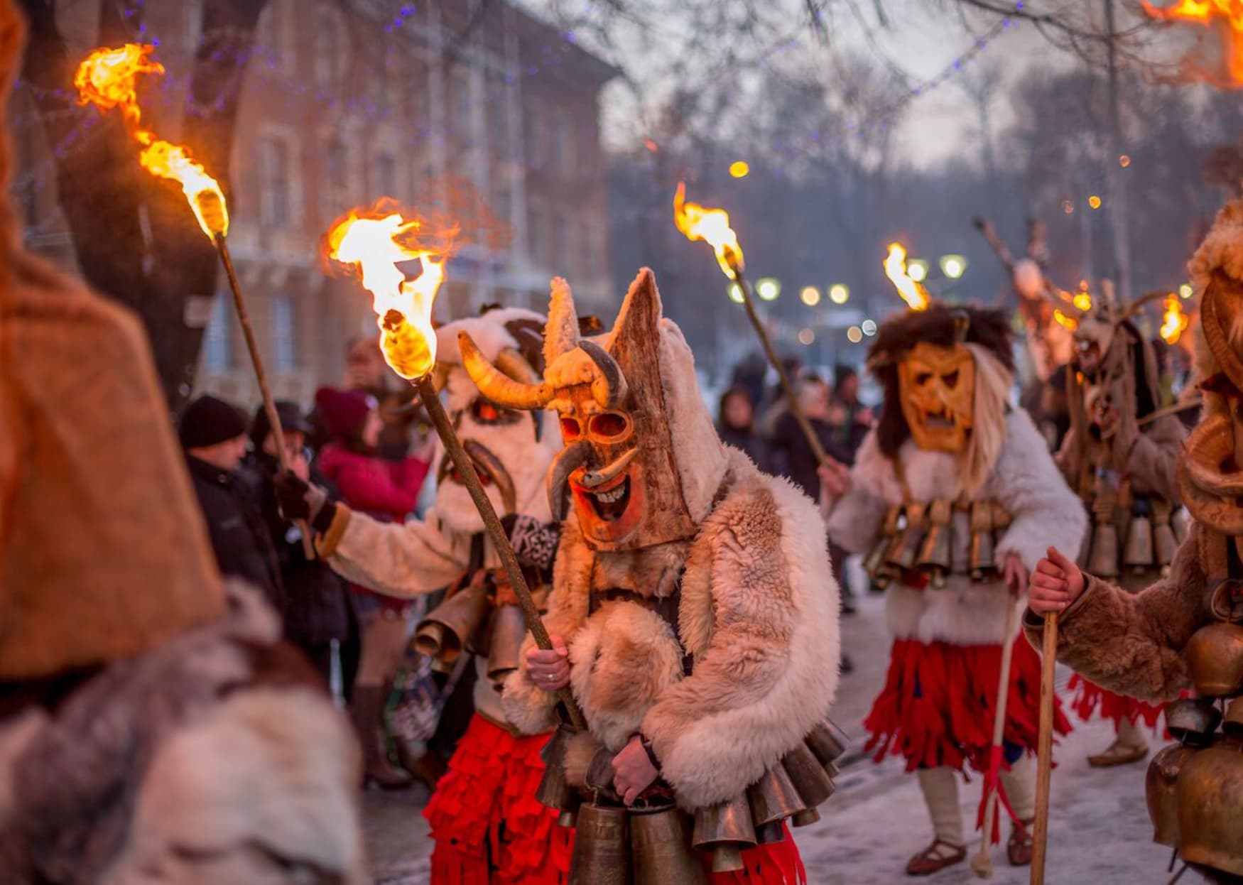 Men participate in Bulgaria’s Suva festival, in which people sport monster costumes to scare evil spirits away. 